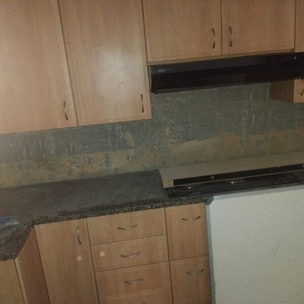 Apartment Interior Repaint & Kitchen Splashback - Old splashback stripped back to the wall