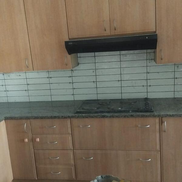 Apartment Interior Repaint & Kitchen Splashback - New white subway-tile splashback