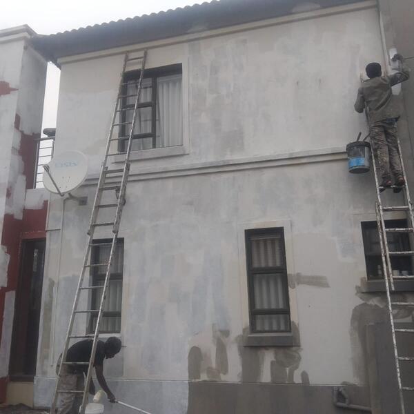 Double-Storey Exterior Restoration - Crack repairs and patch plastering on the side wall