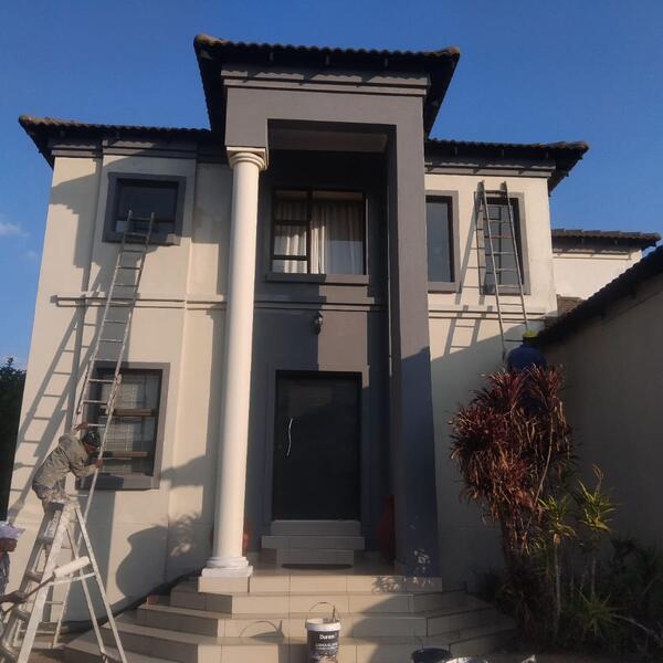 Double-Storey Exterior Restoration - Charcoal accents going on around the entrance