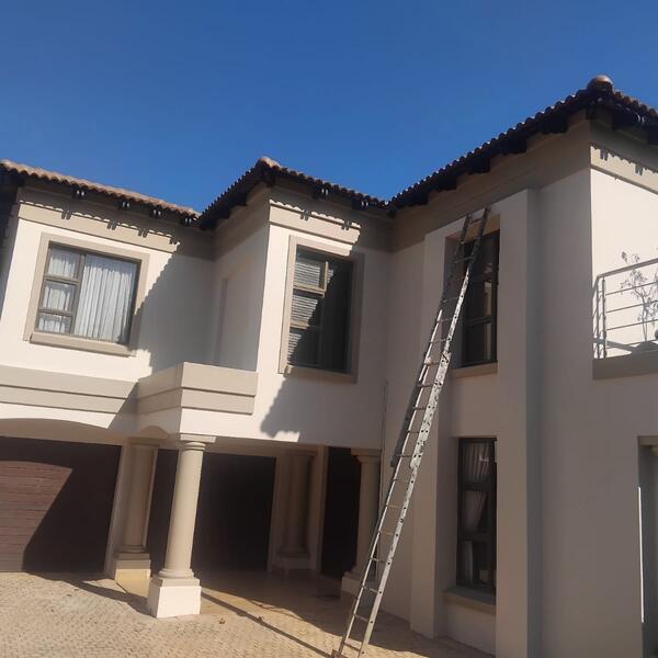 Family Home & Boundary Wall Repaint - Final coats on the upper storey