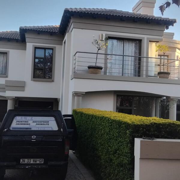 Family Home & Boundary Wall Repaint - Front of the home finished in cream and stone