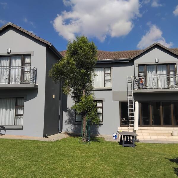 Modern Home Exterior Makeover - Completed rear elevation in modern grey