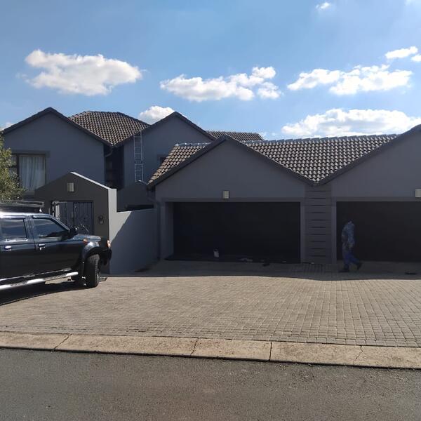 Modern Home Exterior Makeover - Front of the home and triple garage complete