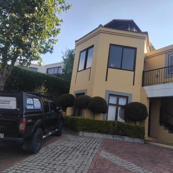 Townhouse Complex Exterior - Street-facing unit with grey window trims